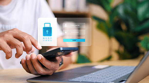 istock Close-up of a man using smartphone with virtual password input and login button. Concept of secure mobile authentication, user access control, and cybersecurity protection. 2223024139