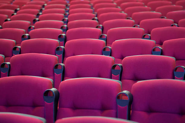 istock Rows of red chairs in an entertainment performance hall 2223027137