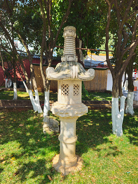 istock Serene Japanese Stone Lantern Surrounded by Lush Greenery in Peaceful Garden Setting 2223029392