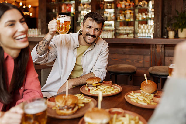 istock Friends Gathering Over Food and Drinks 2223029470