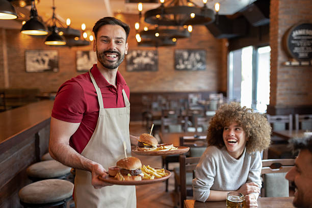 istock Burger with a Smile – Waiter Serving Comfort Food 2223029472