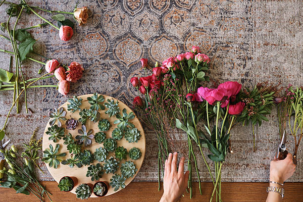 istock Female hands arranging fresh flower bouquet 2223029740