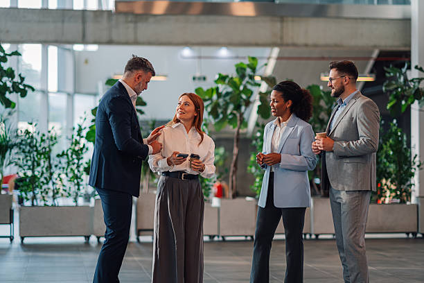 istock Business people talking during coffee break in modern office 2223035215