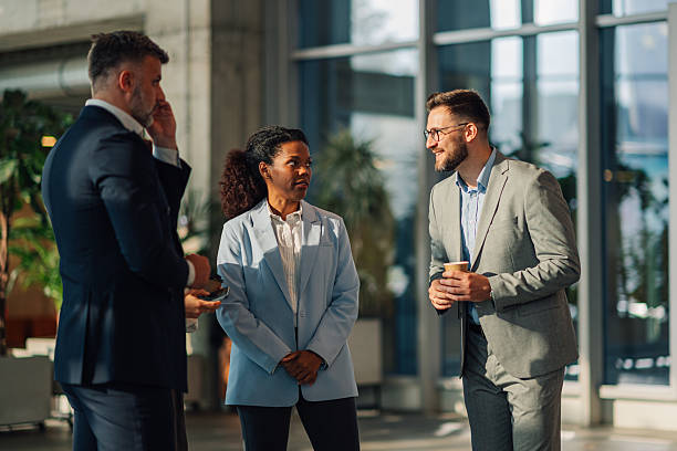 istock Business people talking during coffee break in modern office 2223035288