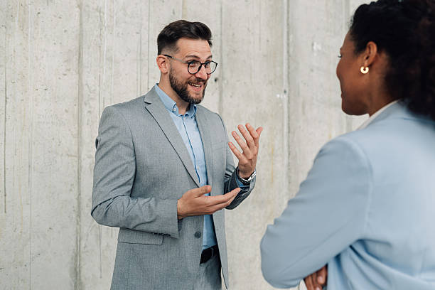 istock Businessman explaining something to his female colleague 2223035663