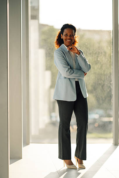 istock Smiling confident businesswoman posing in modern office 2223035963