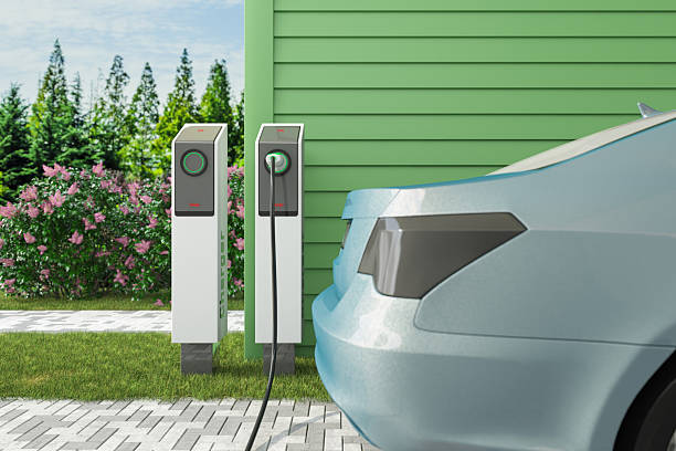 istock Electric Car Charging at Home With Wall-Mounted Charger 2223040440