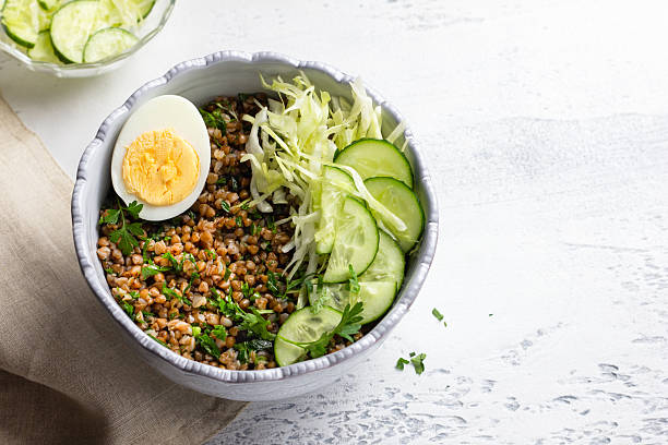 istock Nutritious buckwheat bowl with fresh cucumber, cabbage, and egg, copy space 2223041779
