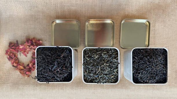 istock l jars filled with organic leaf tea, arranged on a burlap surface with decorative heart made of dried flowers 2223042354