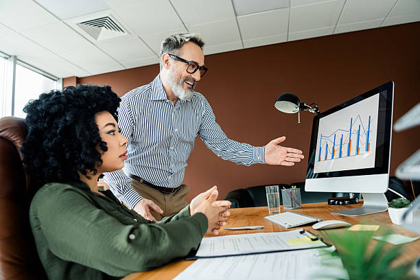 istock Professional coworkers analyzing data on a computer monitor in a modern office environment for business collaboration 2223043518