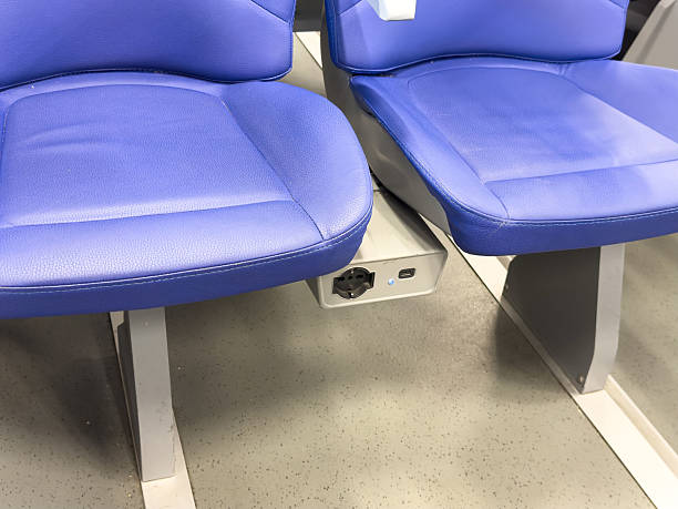 istock Blue train seats with integrated power outlet in modern public transport 2223044435