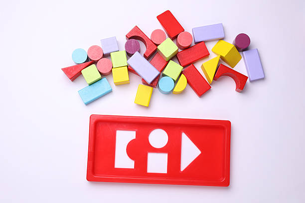 Children's sorter with colorful wooden figures on a white background