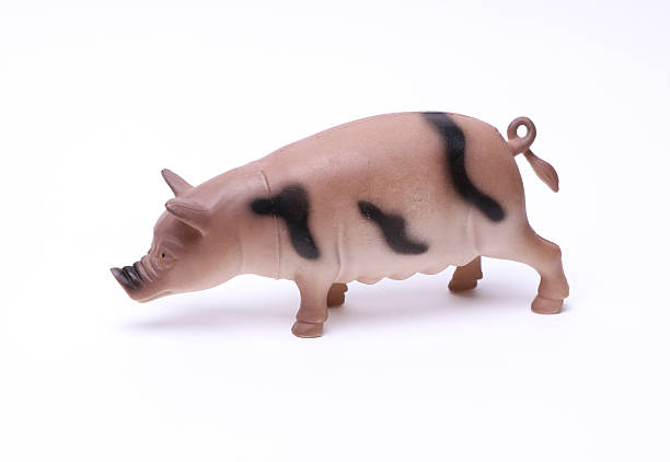 istock Toy plastic pig on white background 2223046001