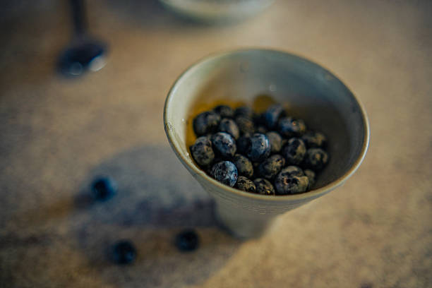 Woman Enjoying Blueberry Snacking Moments