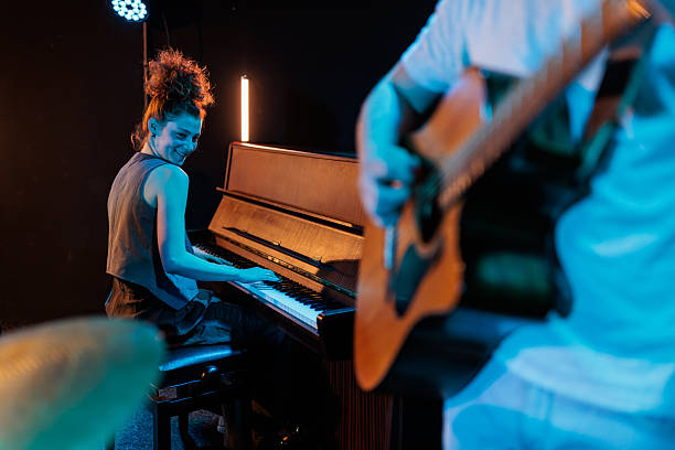 istock Pianist smiling with joy during live band performance 2223048804