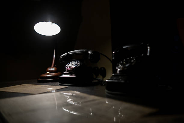 Taiwan - Jan 16, 2024: Taipei's New Culture Hall - Publicly accessible. Close-up of a desk with documents under a banker's lamp (known for their retro style and practicality) in an exhibition hall, creating a vintage atmosphere.