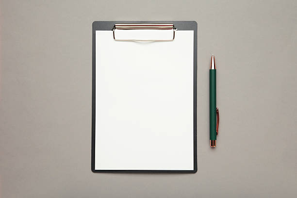 istock Pen and black clipboard with paper on grey background. 2223052955