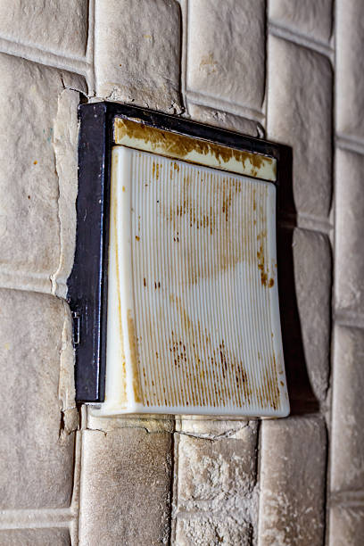 istock Dirty Old Light Switch on Wallpapered Wall — Vintage Interior, Burnt Plastic Switch, Neglected Home Electrical Detail 2223053727