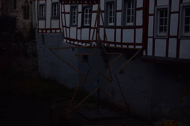 Monreal, Germany - November 29/2024: dark ancient houses at the river