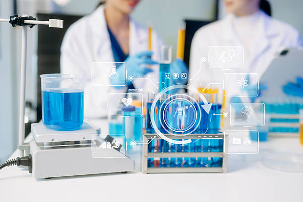 istock Two Asian female scientists conduct biochemical research using micro pipettes in a high-tech medical lab 2223056870
