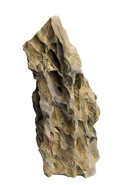 istock Tall and jagged dragon stone rock with rough surface texture isolated on a white background with clipping path. 2223057937