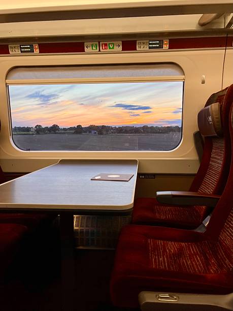 istock Sunset pink and orange sky through train window 2223058686
