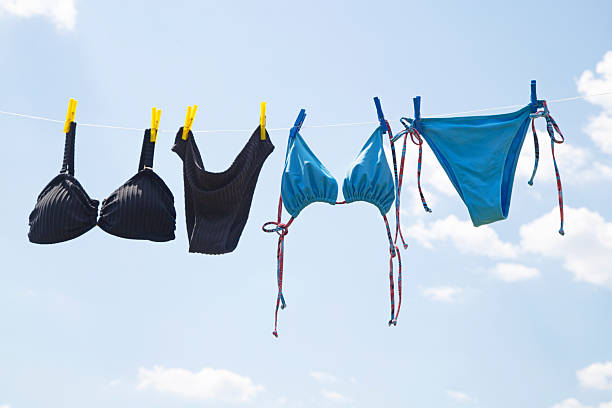 istock Swimsuits hanging on a line to dry 2223058764
