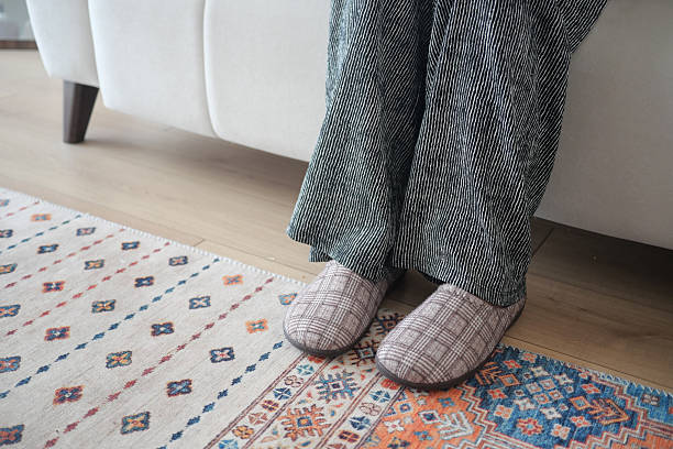istock Cozy indoor setup with relaxed feet on a soft rug 2223059421