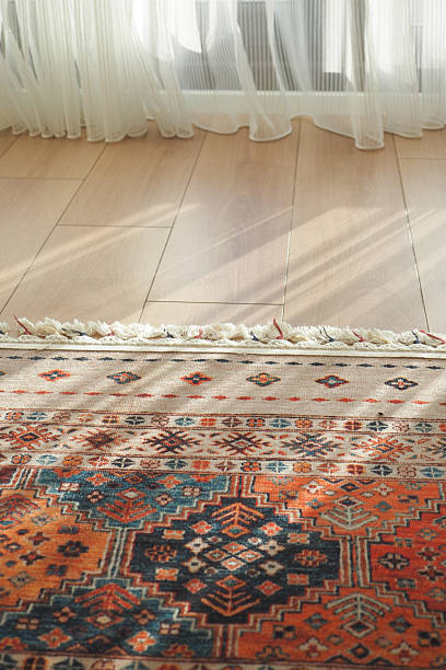 istock Sunlight illuminating a colorful patterned rug indoors 2223059533