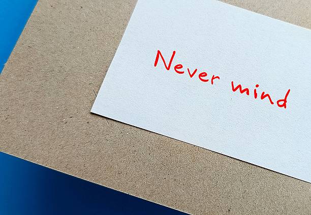 istock Note written NEVER MIND - tell someone not to worry about something because it is not important or not to be concerned 2223062112
