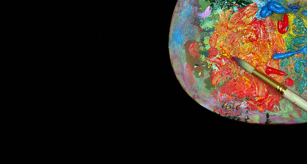 istock bright colorful artist palette isolated on a black. copy space 2223065356