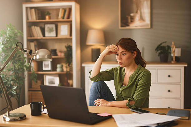 istock Stressed freelancer woman working from home having headache 2223066979