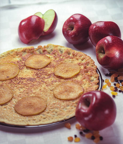 Breakfast served on the table - pancakes, green tea, apples