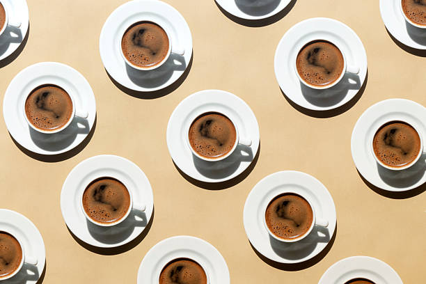 istock Pattern made of cup of coffee on beige background 2223069395