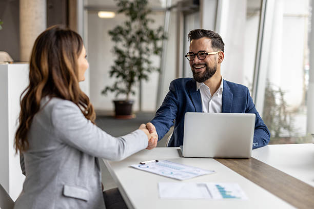 istock Businesspeople shaking hands after successful meeting in office 2223069801