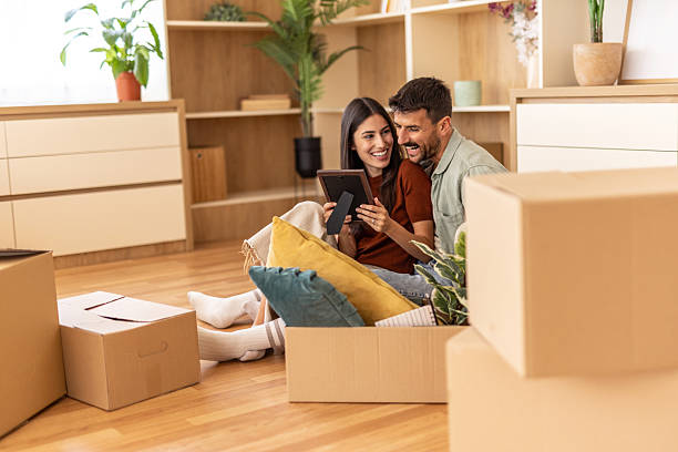 istock Happy couple enjoying new home together 2223070068