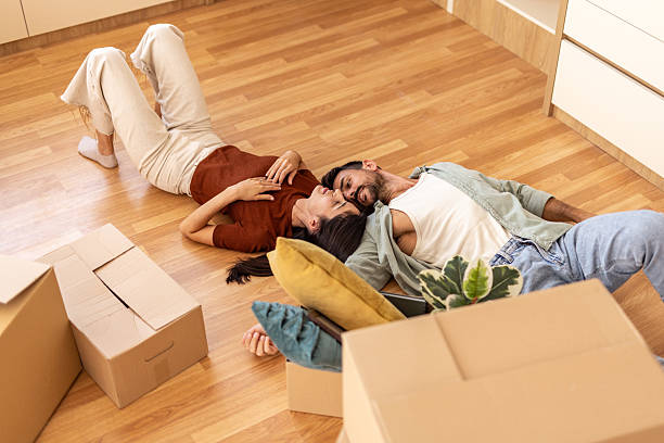 istock Young couple relaxing on new home floor 2223070536