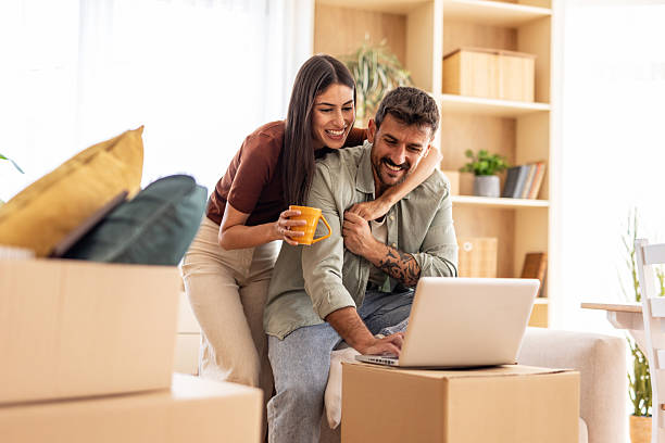 istock Happy couple planning new home interior design using laptop 2223071880