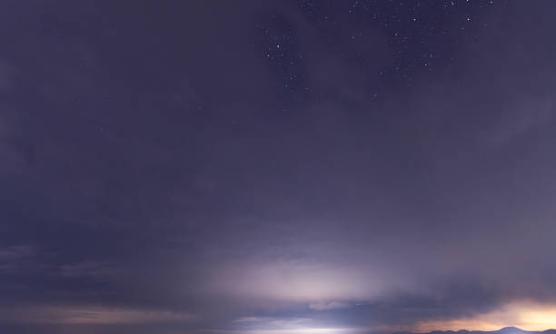 istock Beautiful night sky background, with long exposure clouds, starry sky. 2223072716