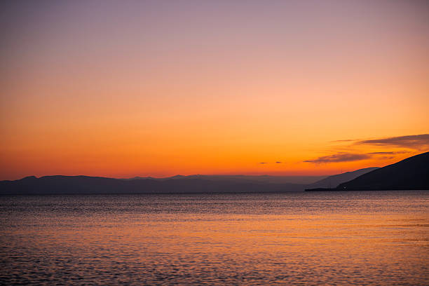 Beautiful sunset with clouds over the lake.