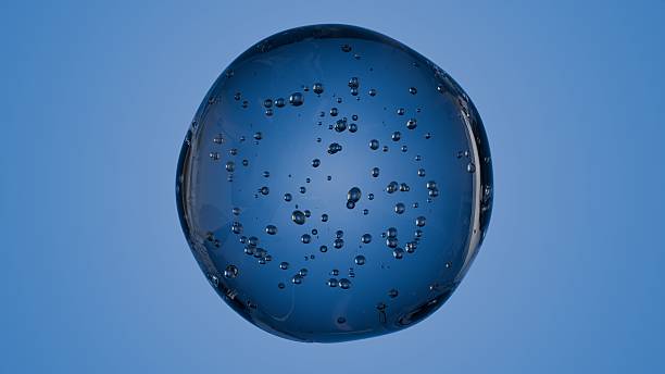 istock Realistic render of a clear sphere filled with air bubbles, set against a light blue sky. Evokes purity, airiness, and calmness — perfect for eco branding, spa visuals, or minimalist health and wellne 2223072884