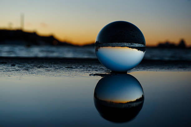 istock Close of a crystal ball in puddle 2223075313