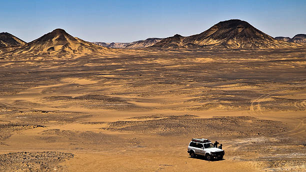 istock Ash-covered hills in Egypt's Black Desert under a clear sky, scenic and remote landscape. Volcanic mountains 2223077013
