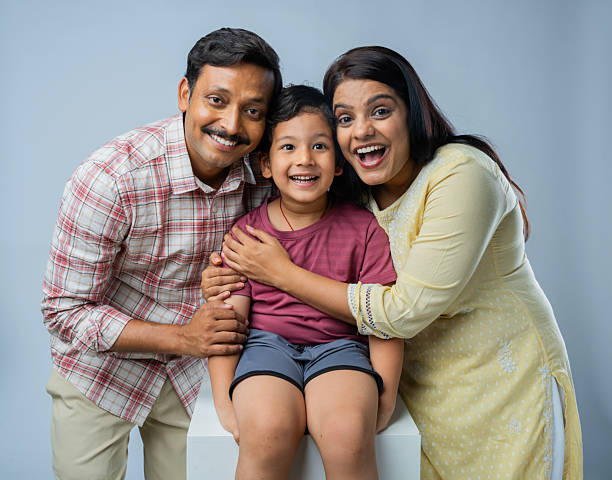 istock Parents with son against white background 2223077427