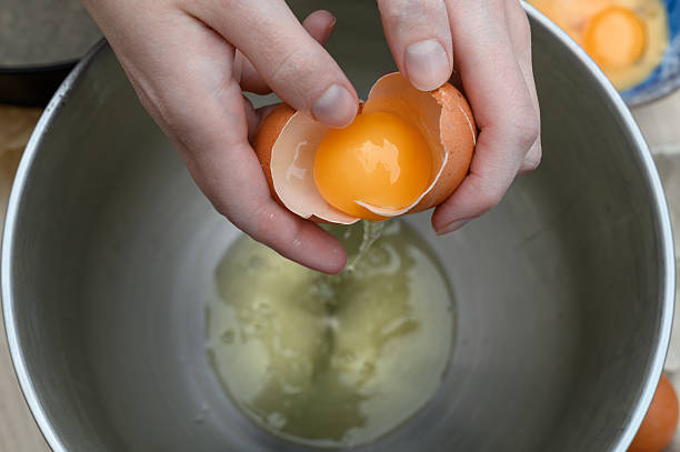 istock Break the eggshell and separate the yolk from the whites

. 2223079386