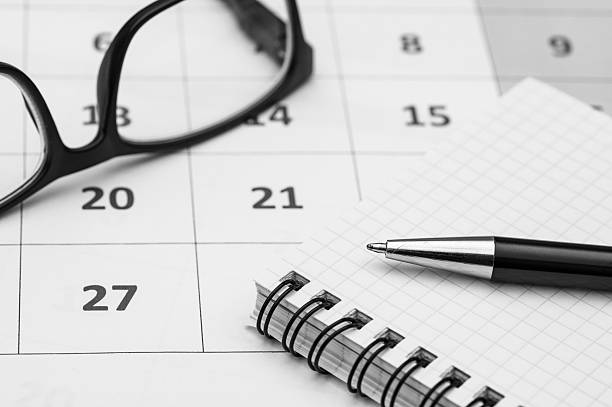 istock organization and planning, calendar, notebook and pen background 2223079439
