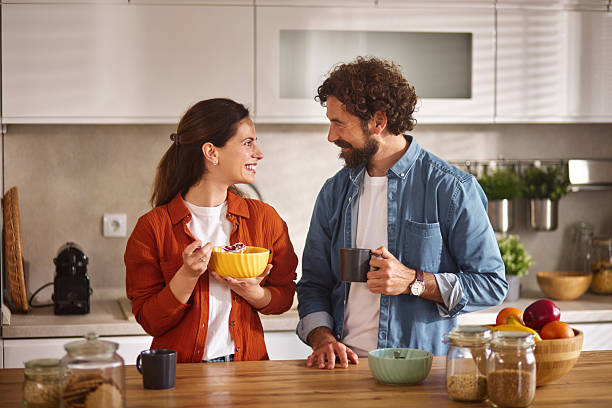 istock Happy couple enjoying breakfast together in modern kitchen 2223080071