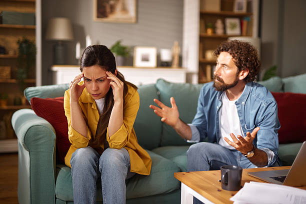 istock Couple arguing about financial problems at home 2223082097
