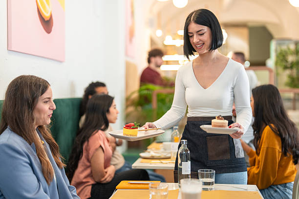 Photo of optimistic nice brunette hair lady serve food wear shirt isolated on red color background