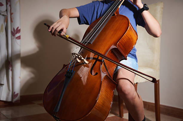 istock Close-Up of Performer Playing Cello Indoors with Passionate Engagement 2223084366
